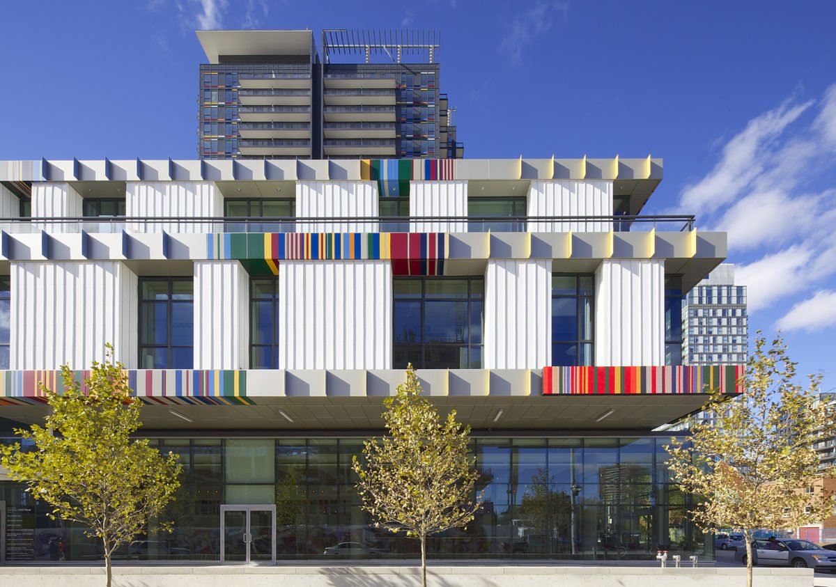 Daniels Spectrum daytime façade — white panels with vibrant color accents