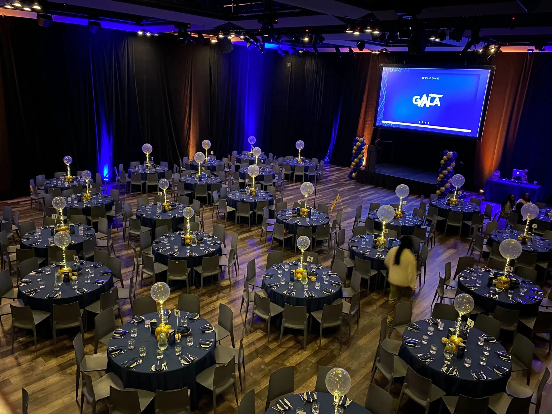 Ada Slaight Hall interior — spacious hardwood floor with stage lighting